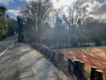 Pooled water caused by blocked road drainage meant that dirty water was sprayed by passing vehicles down the hill and on to the courts rendering them unplayable.